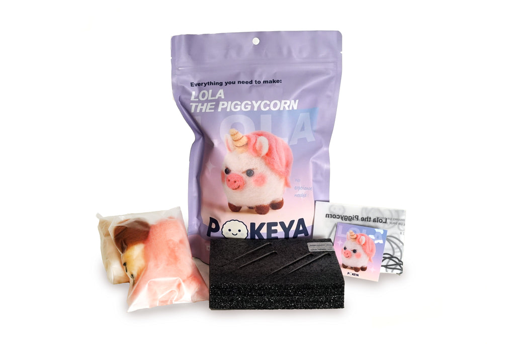Lola the Piggycorn needle felting kit with felt, felting pad, needles, template, and card with link to full video instructions